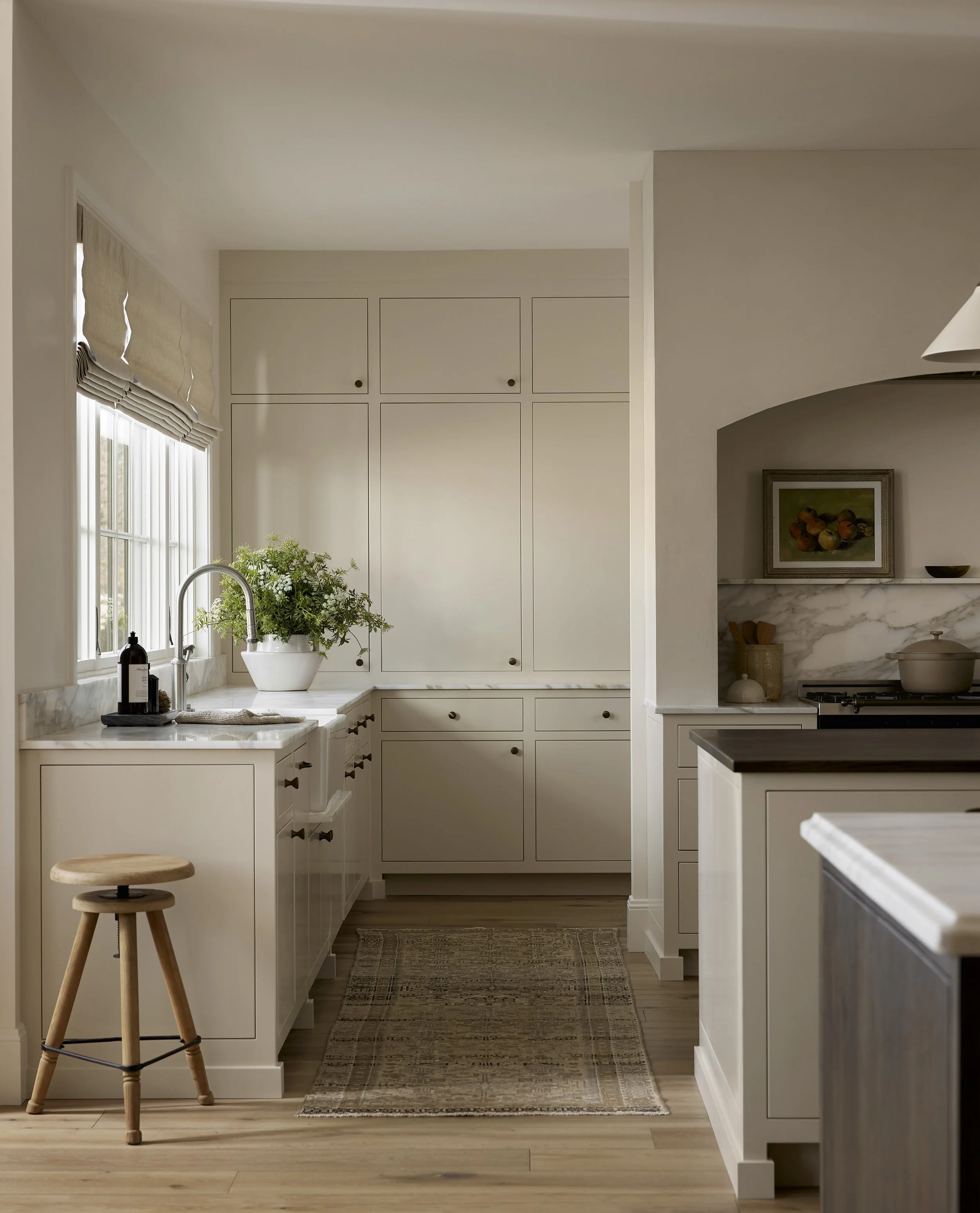 Dining room with Spanish woven chairs and warm painted walls
