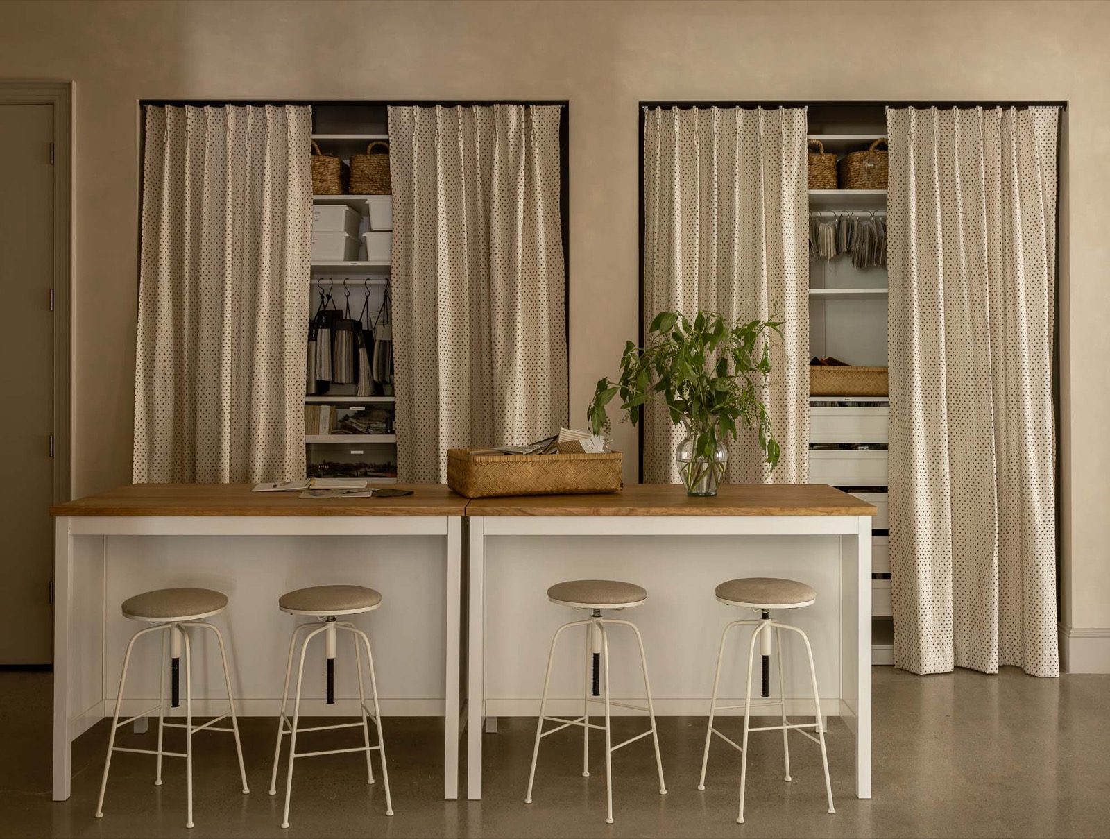 Design library with Roman Clay plaster walls, painted islands, and bar stools
