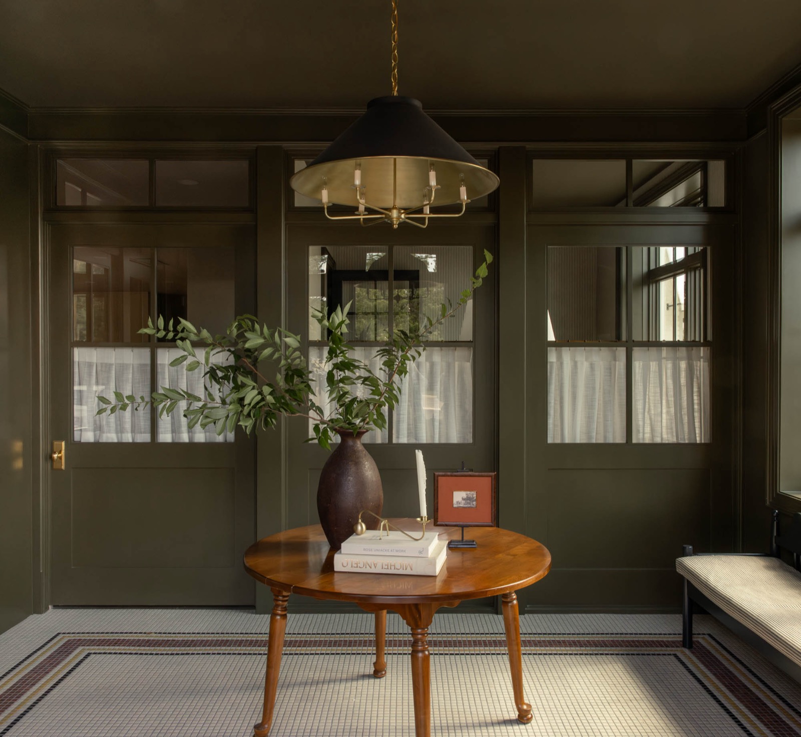 Entry of the W Design Collective office with glazed doors and trim painted in Farrow and Ball Cardamom