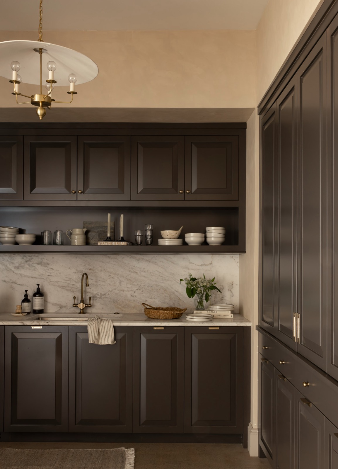 Office kitchen with cabinetry finished in Sherwin-Williams Sealskin